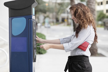 woman uses a ufirst credit union ATM